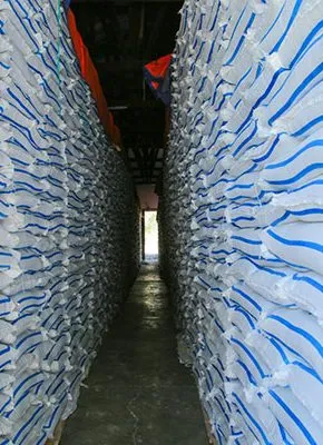 Warehouse stacked with export-ready sugar bags